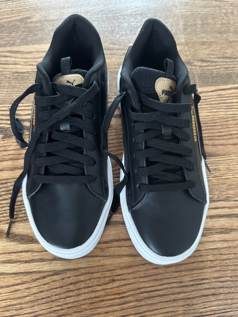 Puma Black Sneakers with White Sole and Gold Accents